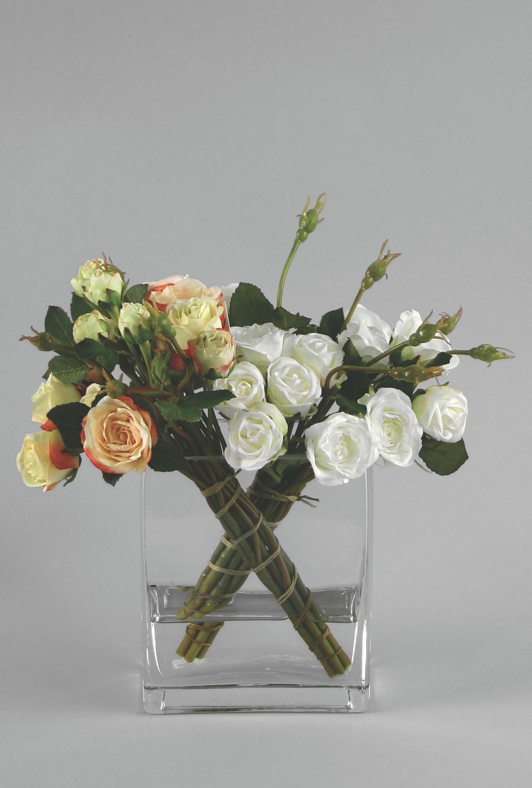 rose arrangement in water peach lime cream 